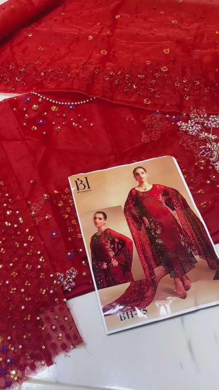 Discover the timeless beauty of Nureh Red Rosy Mouse from the Luxury Organza Collection. This stunning master replica features intricate embroidery, premium organza fabric, and elegant design — perfect for festive and wedding wear. A top Pakistani dress by Shaebiz. Order Now.